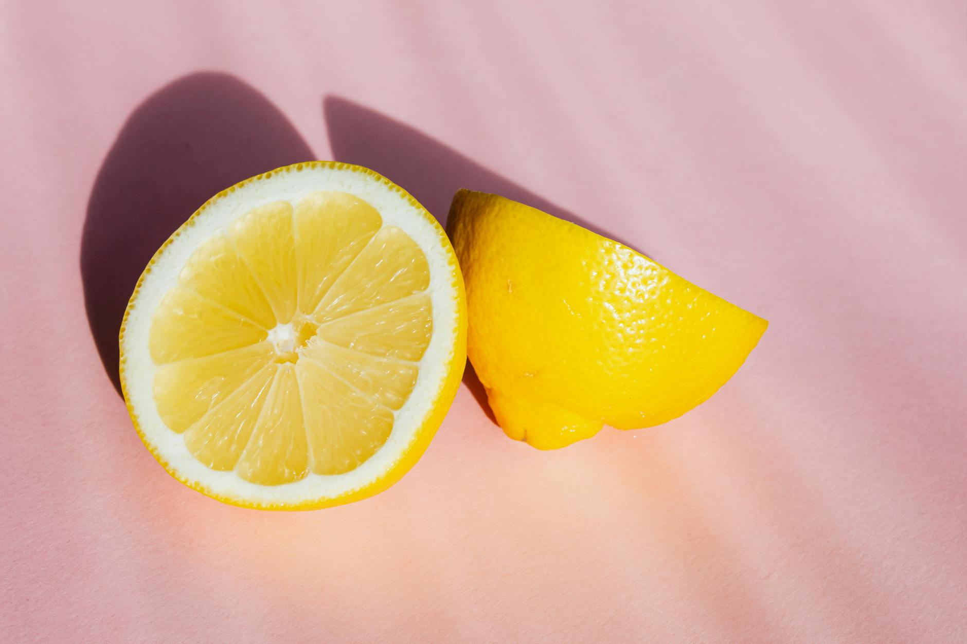 Two fresh lemons on a minimalist white background, symbolizing clarity and simplicity in understanding arousal physiology